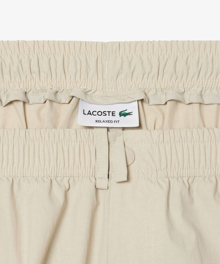 LACOSTE「立体裁断 ナイロンワイドカーゴパンツ / テーパードワイドパンツ」|カーゴ|